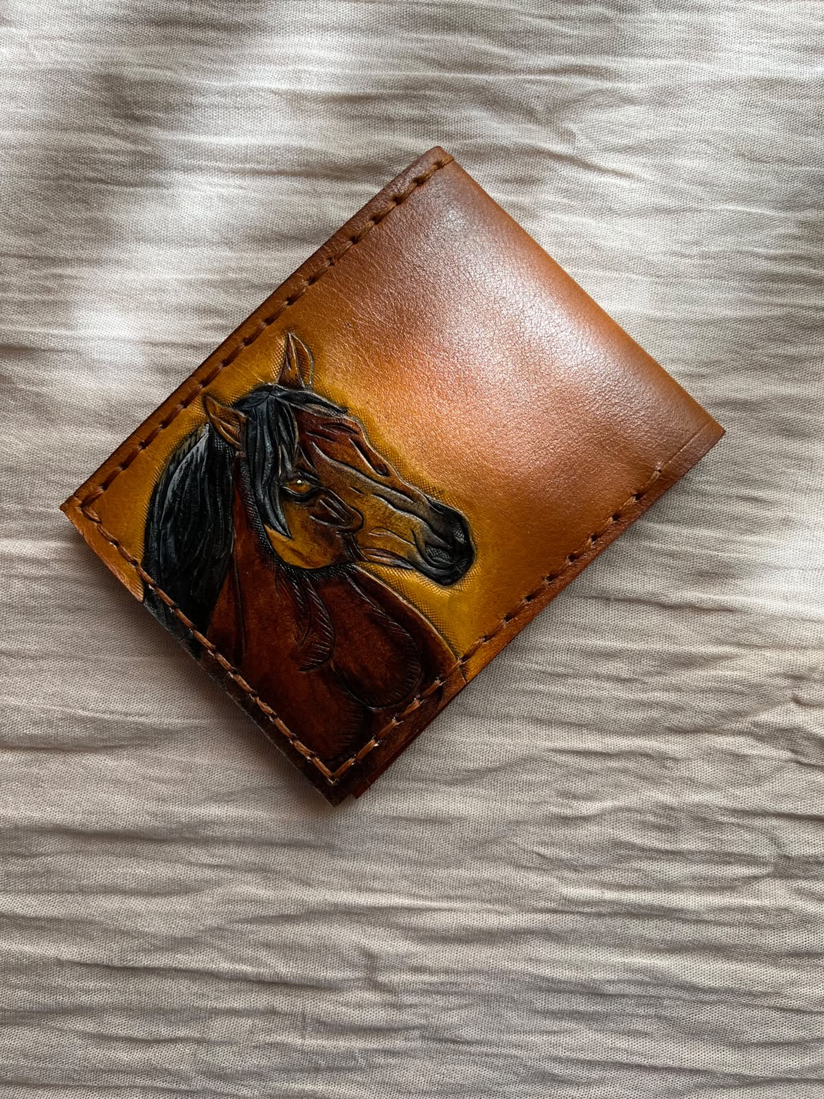 Horse-tooled wallet detail